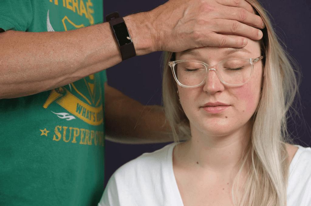A client receiving massage from Chris