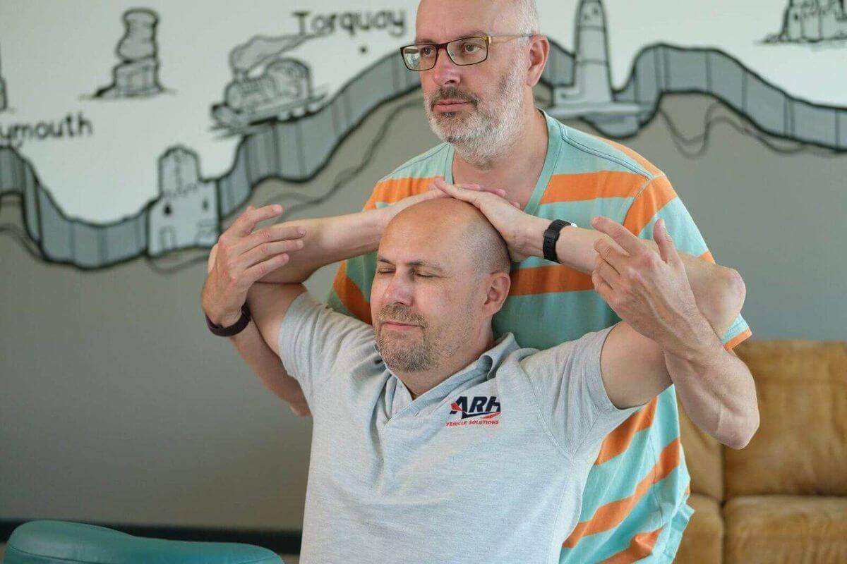 A client receiving massage from Chris
